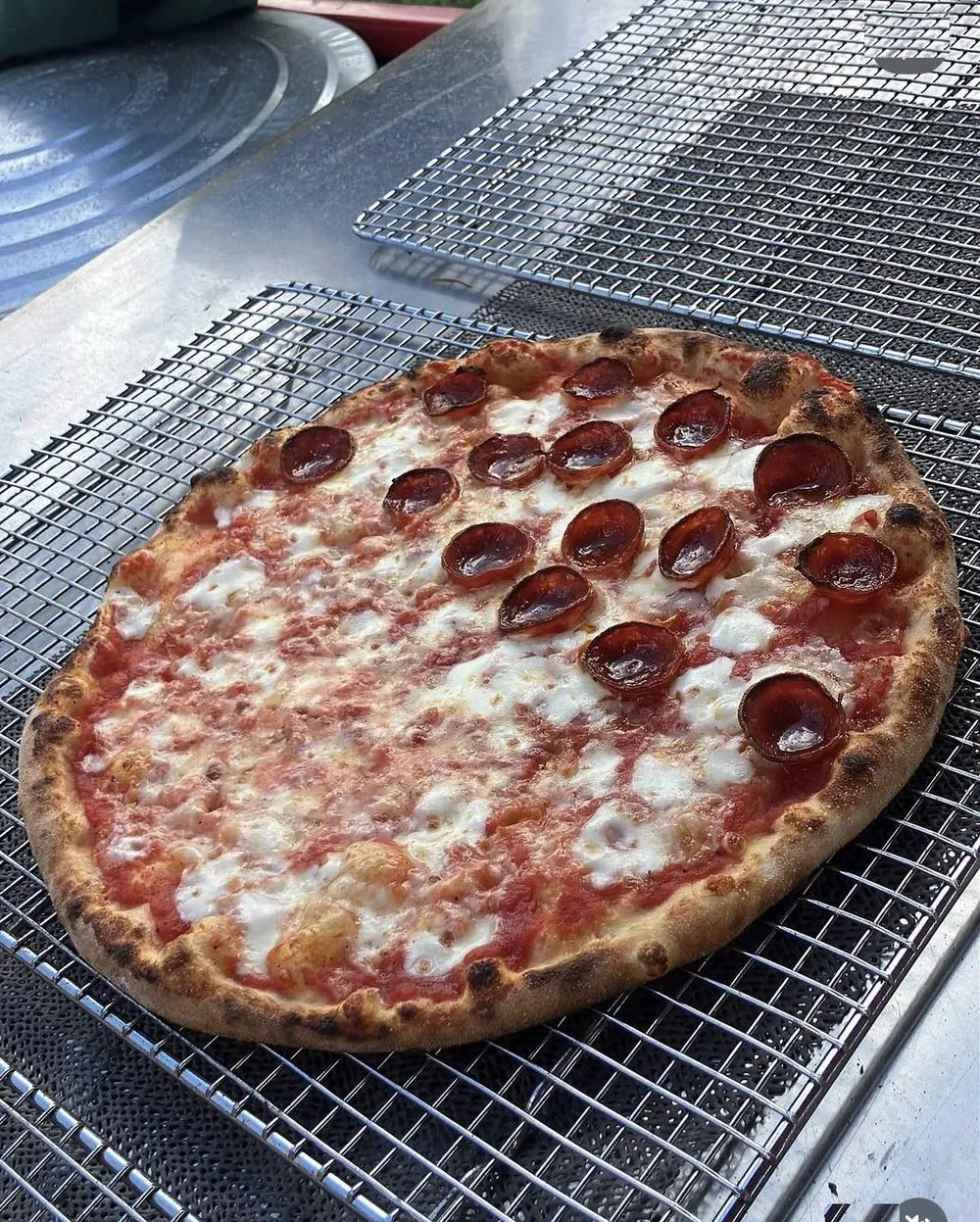 11-inch wood-fired pepperoni pizza fresh off the peel at a Palm Beach County event